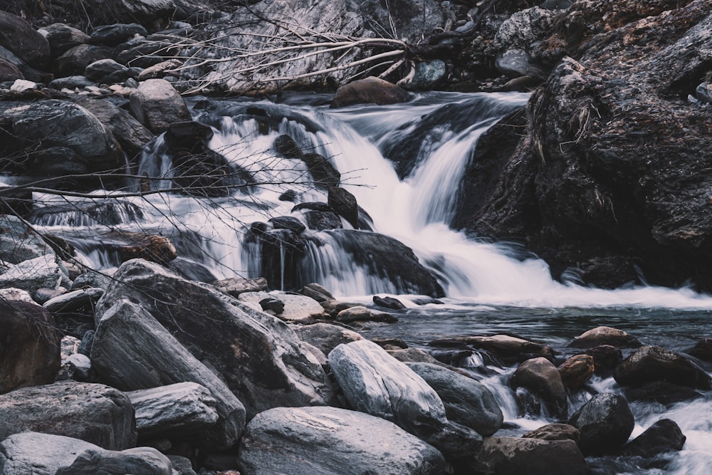 water falls in the middle of rocks