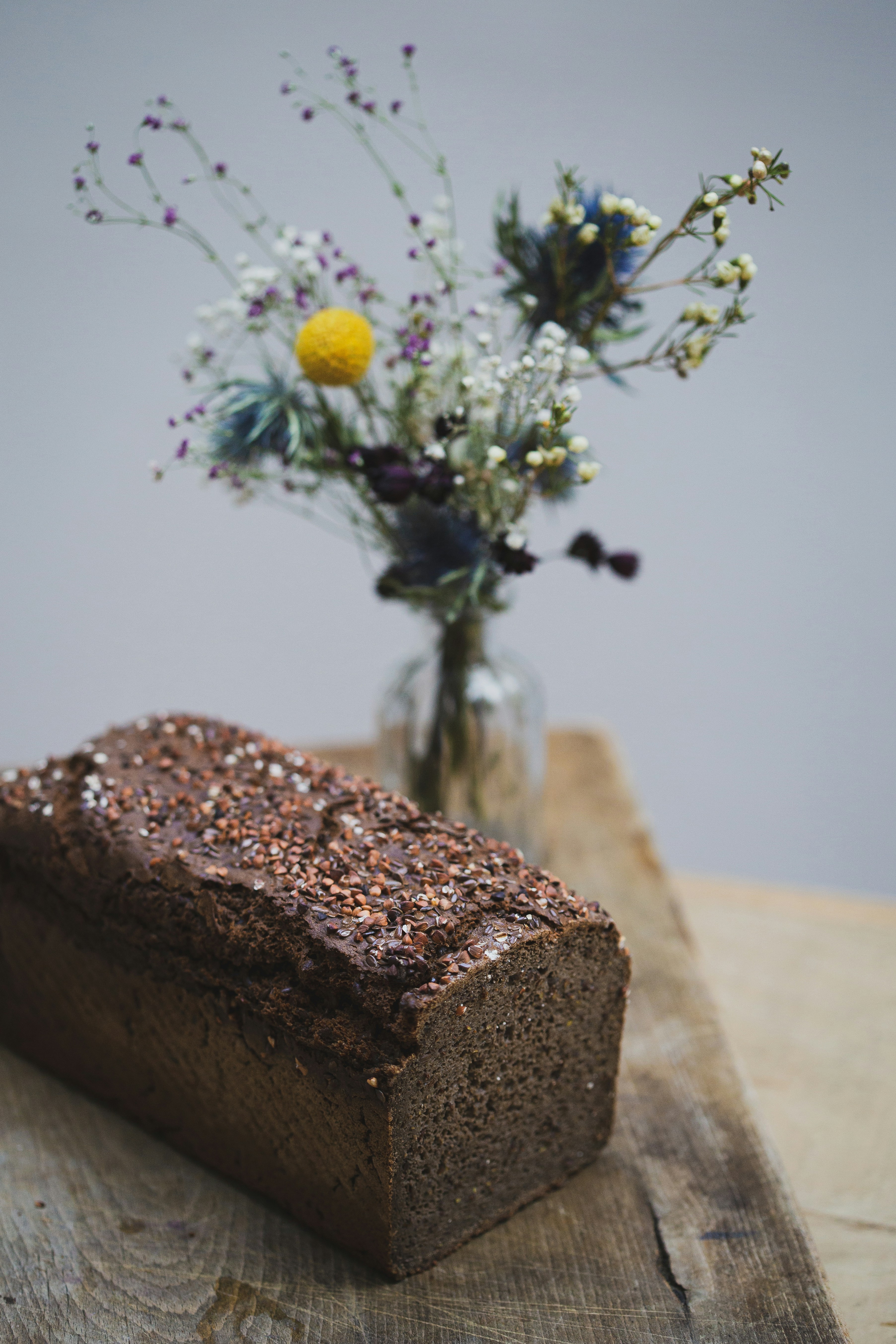 brown cake with yellow flowers on top