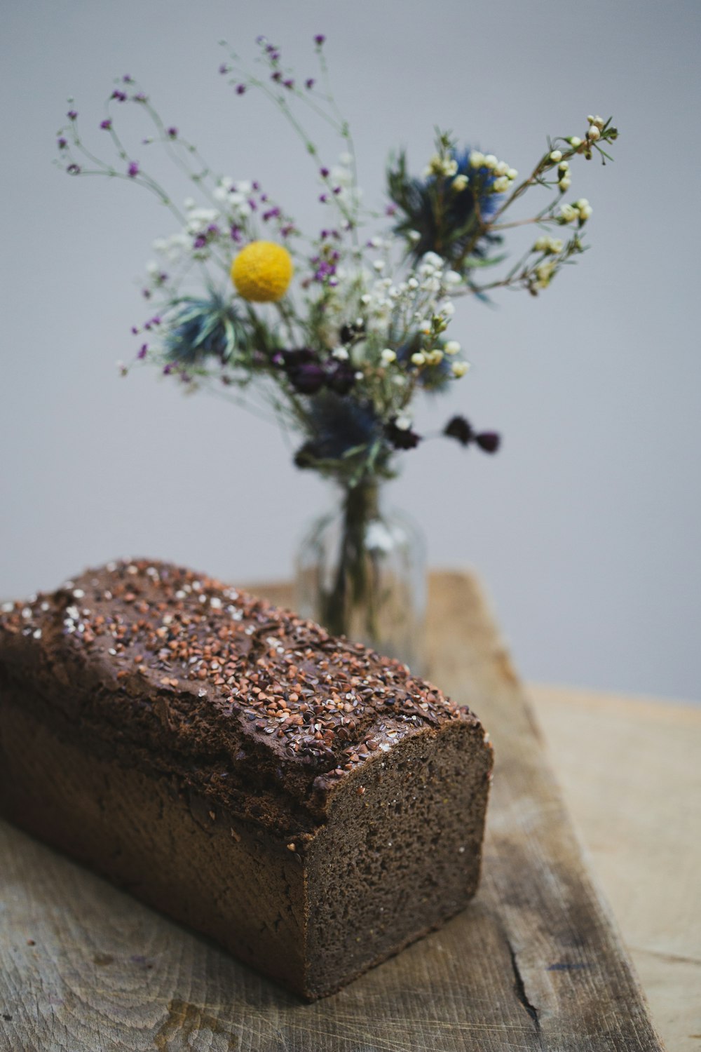 brown cake with yellow flowers on top