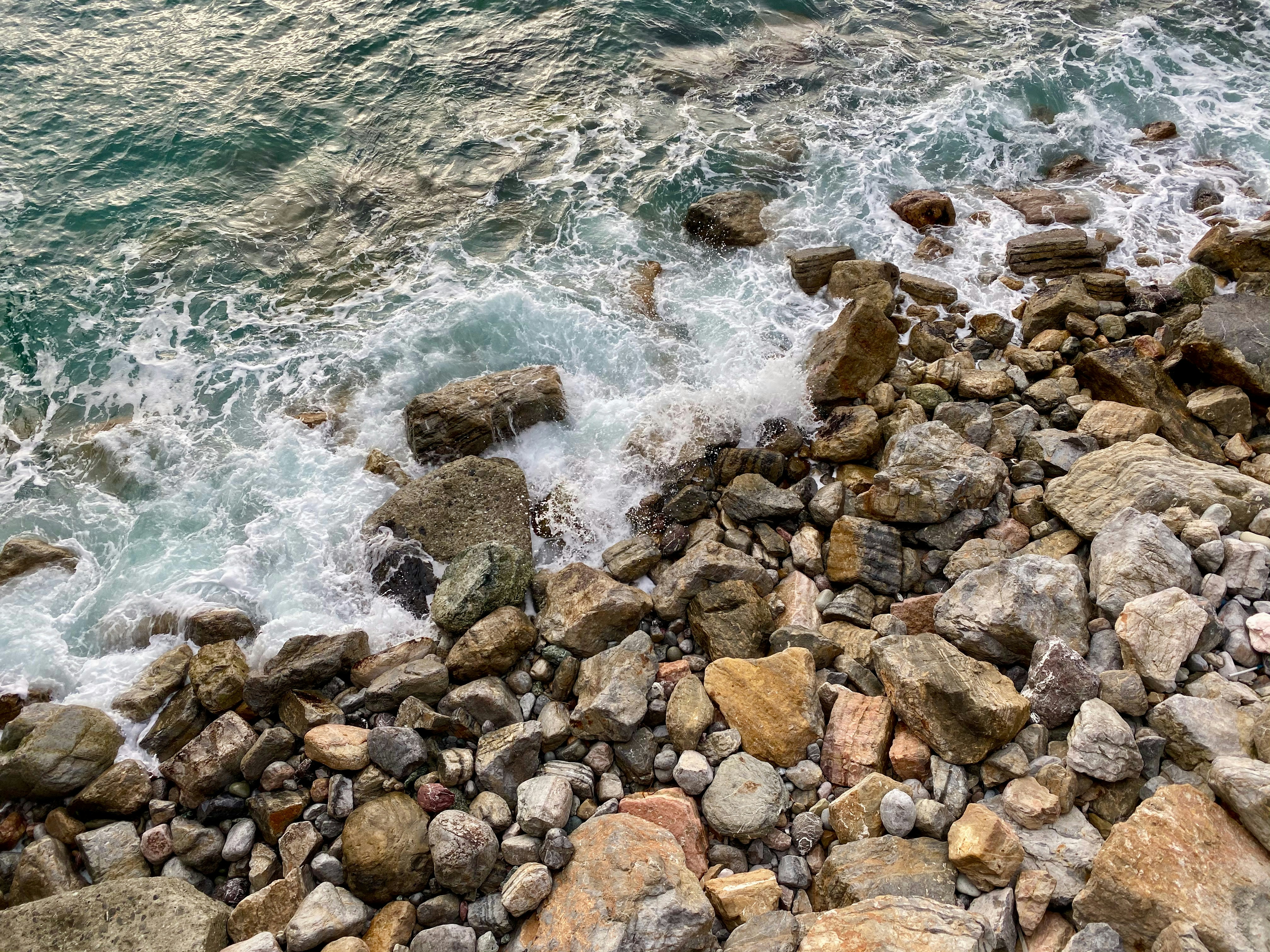 brown rocks on seashore during daytime, 