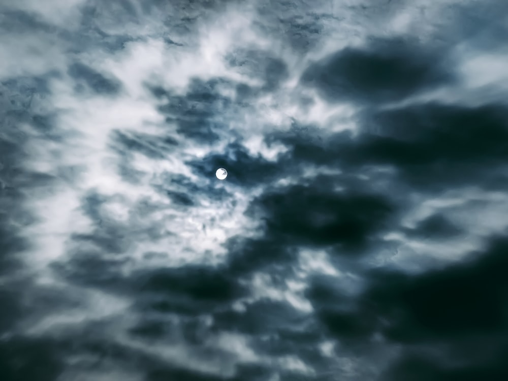 full moon covered by clouds