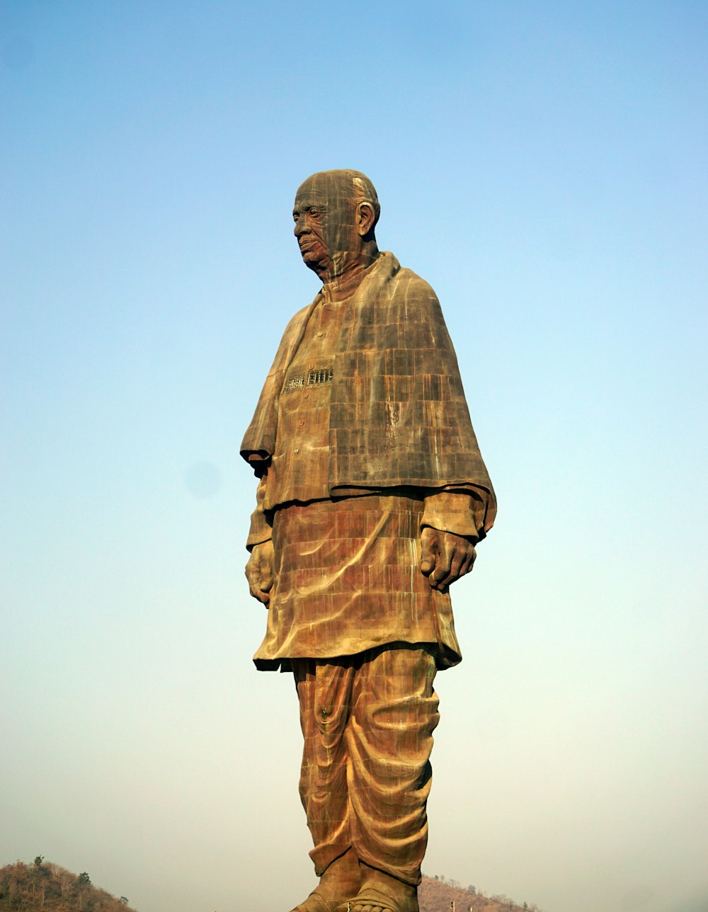 man in brown suit statue