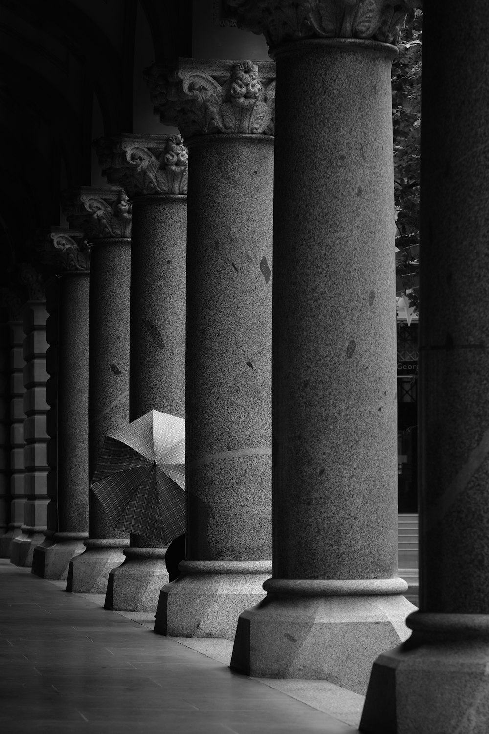 gray scale photo of concrete pillar