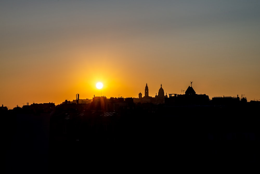 silhouette of building during sunset