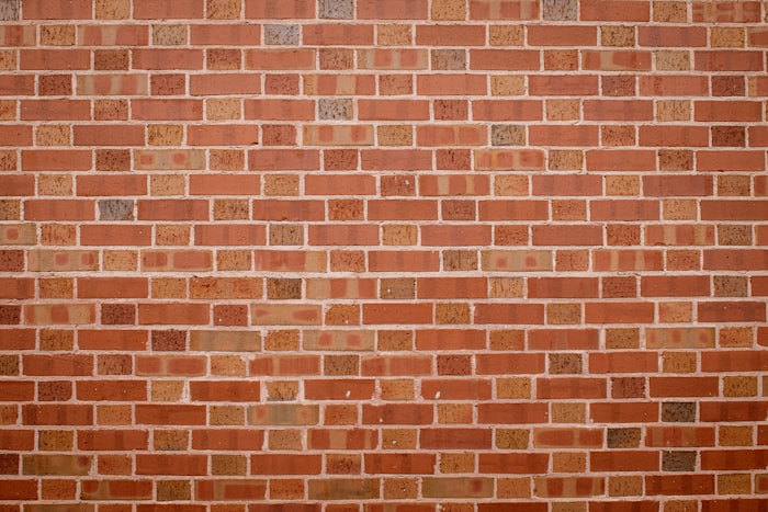 Freshly tuckpointed brick facade with clean white mortar joints
