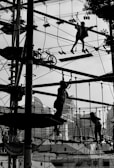 Children enjoying a ropes course, demonstrating courage and balance.