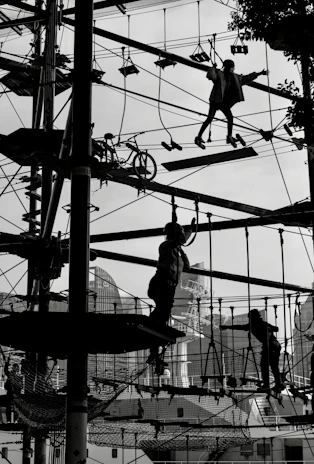 An outdoor team-building activity with students collaborating enthusiastically, framed by the city skyline.