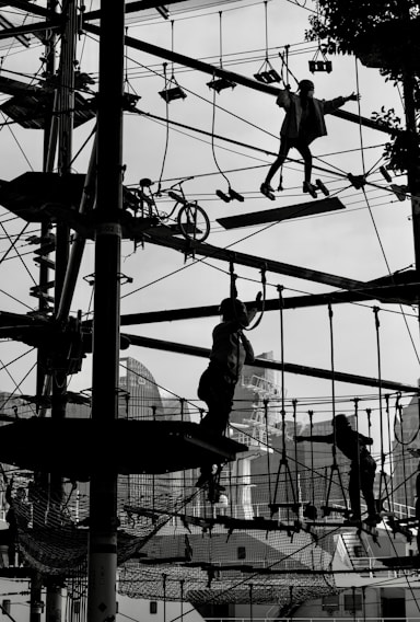 A vibrant outdoor team-building activity with participants engaged in various challenges.