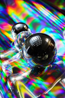 Close-up of translucent spheres reflecting light in a dynamic design.