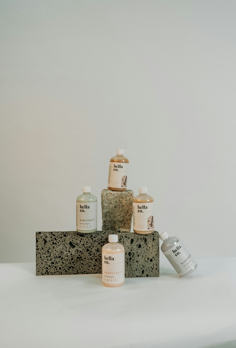 white and brown bottles on black and white marble table