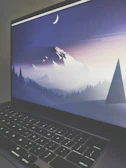 Laptop cover adorned with a serene moon phase illustration in calming blue tones
