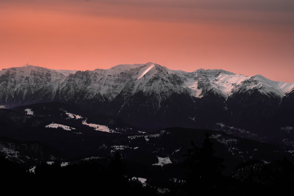 snow covered mountain under blue sky during daytime