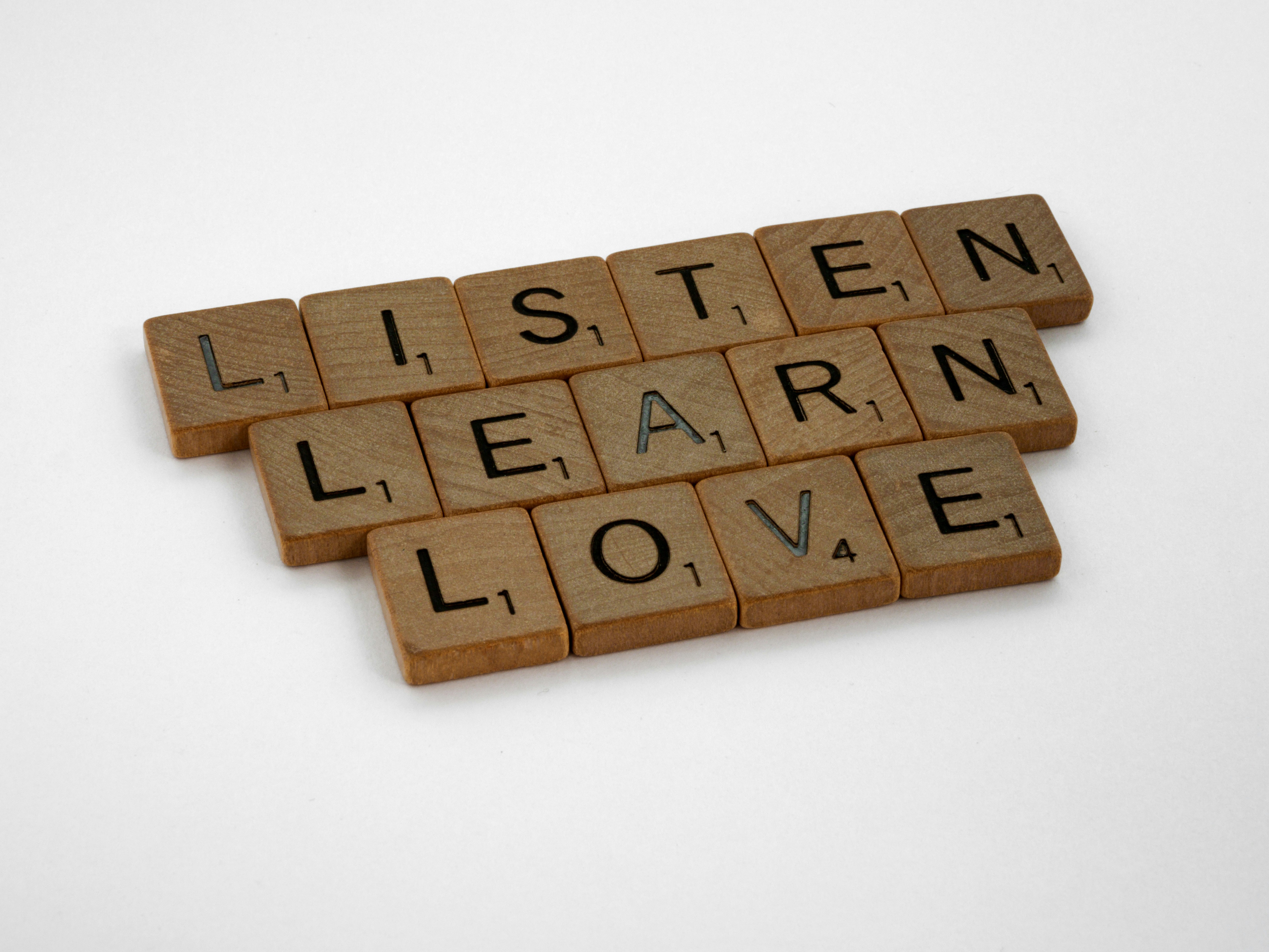 scrabble, scrabble pieces, lettering, letters, wood, scrabble tiles, white background, words, quote, letters, type, typography, design, layout, focus, bokeh, blur, photography, images, image, listen, learn, love, listen learn love, counselling, counseling, counselor, counsellor, therapy, help, depression, trouble, 