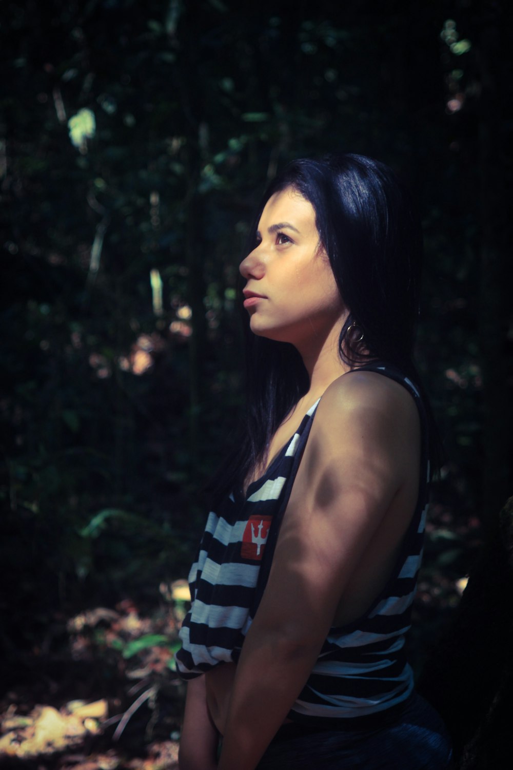 woman in blue and white striped tank top