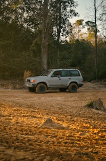 white suv on dirt road