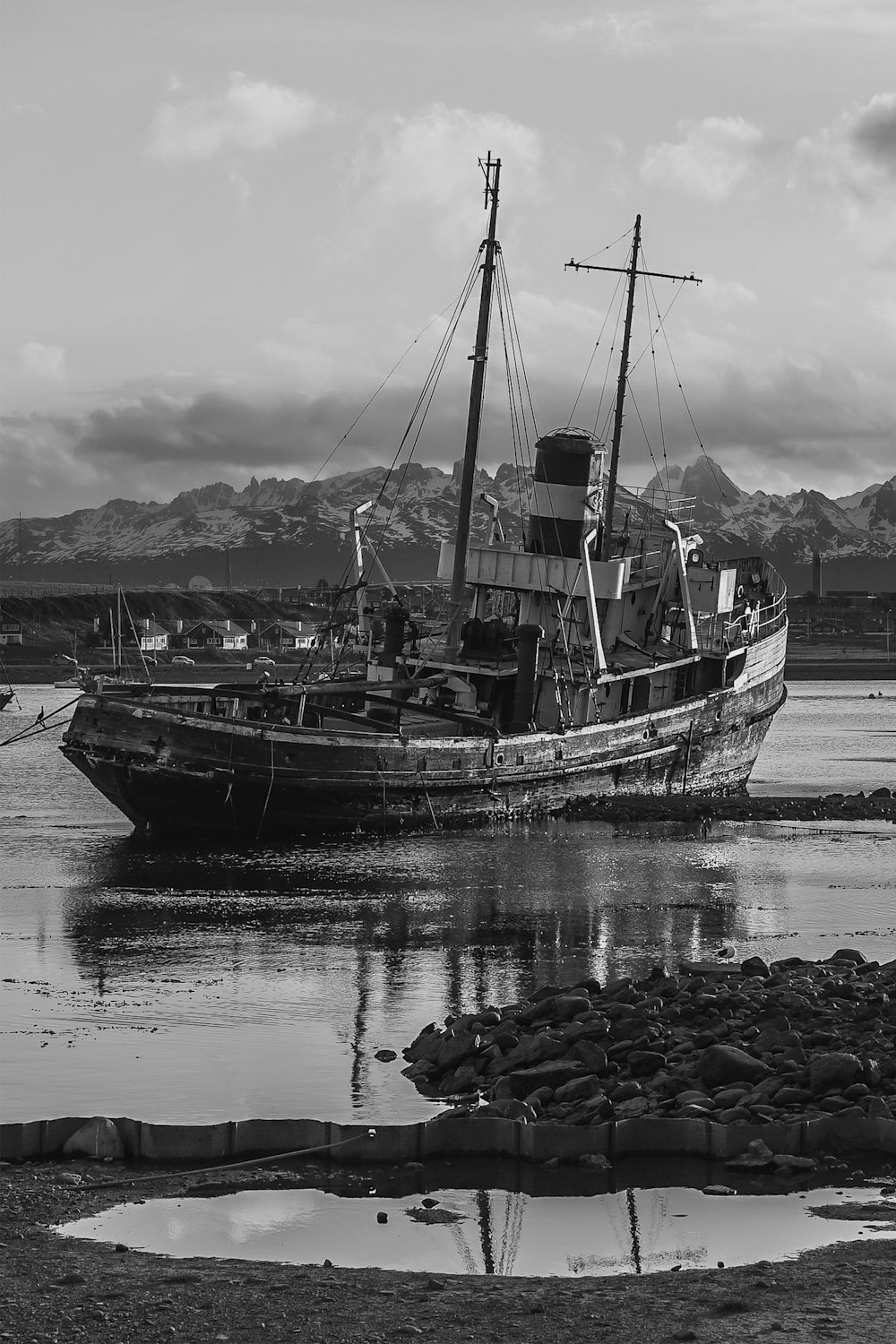 grayscale photo of boat on water