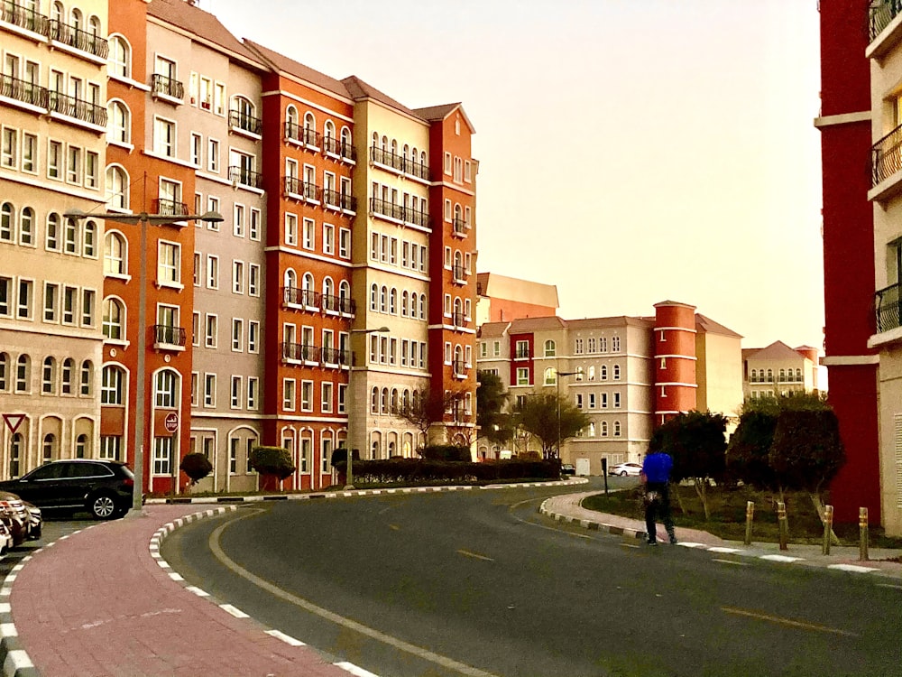 people walking on street near brown concrete building during daytime