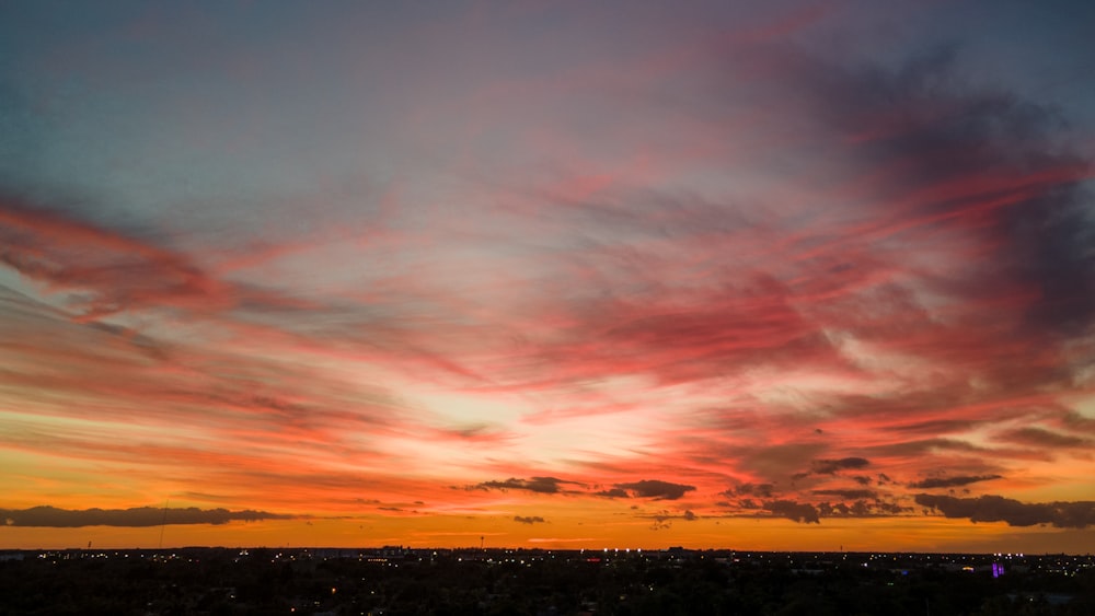 silhouette of city during sunset