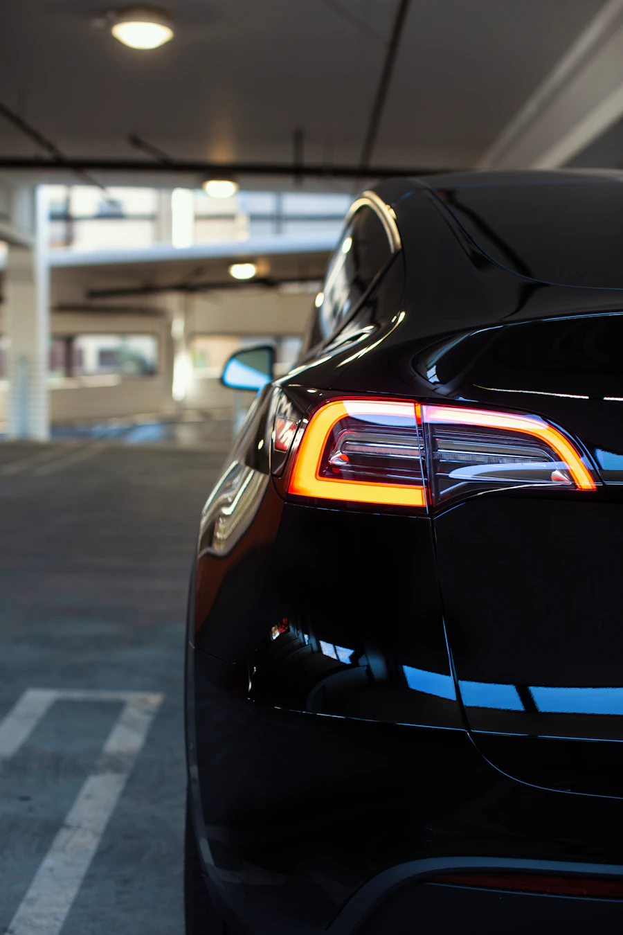 The illuminated rear light bar of a Tesla