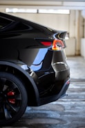 black car on gray concrete road