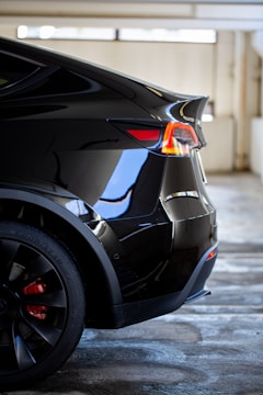 black car on gray concrete road