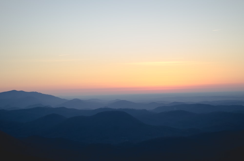 silhouette of mountains during sunset