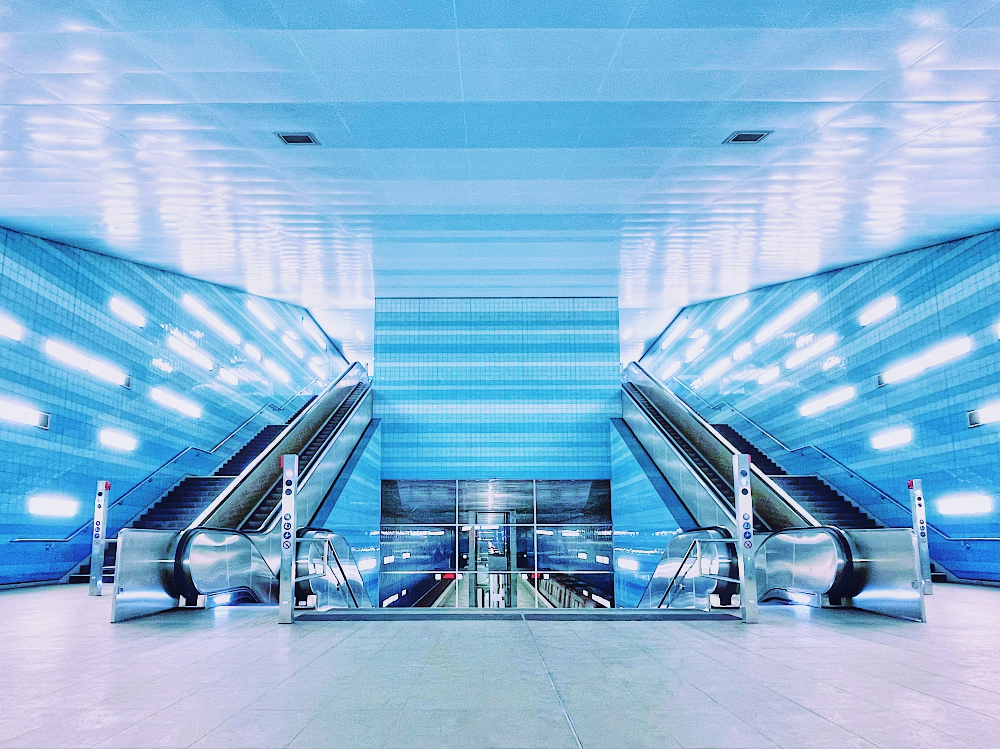 white and black escalator in a building, Hamburg Hafen City Underground 