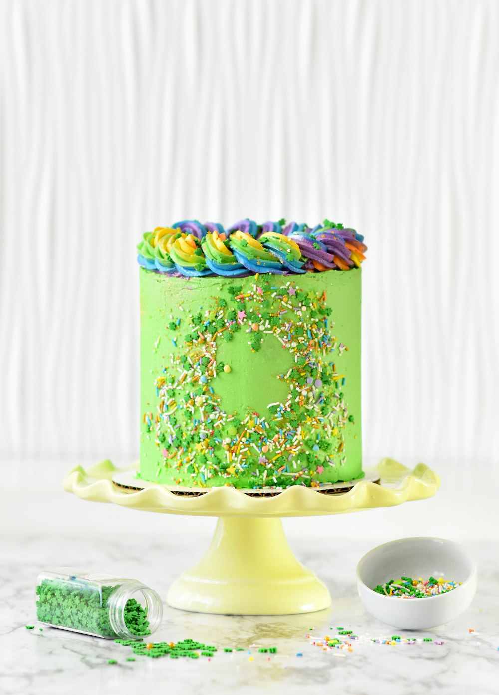 green and white floral cake on white ceramic plate