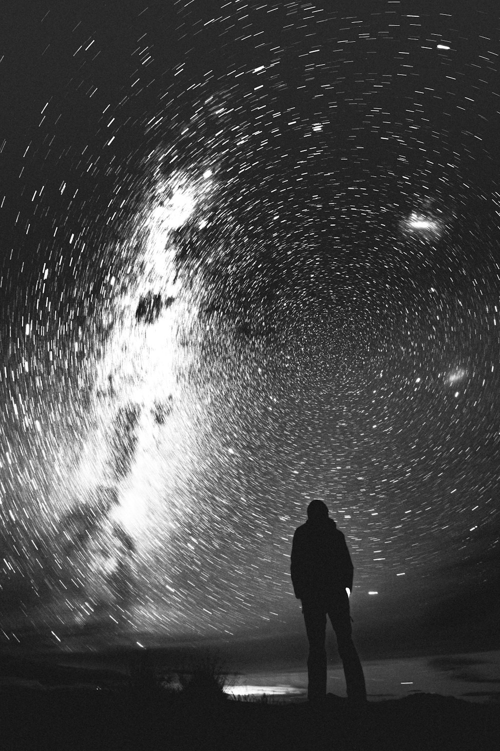 silhouette of man and woman under water