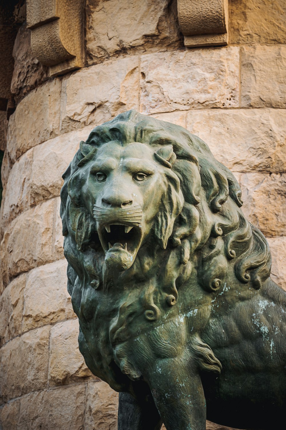 grey concrete lion head statue