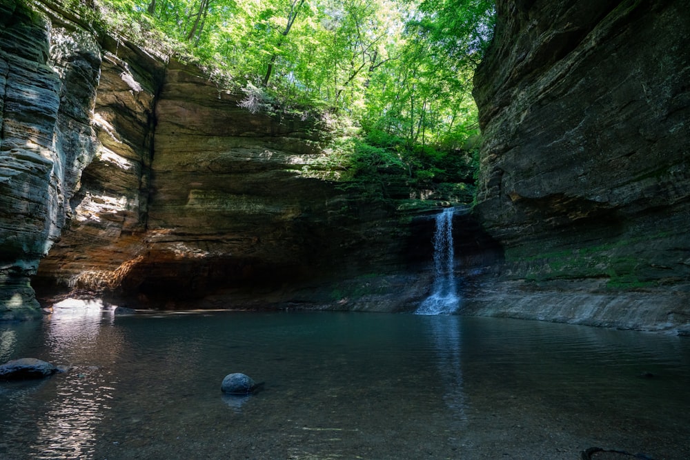 brown rock formation on river