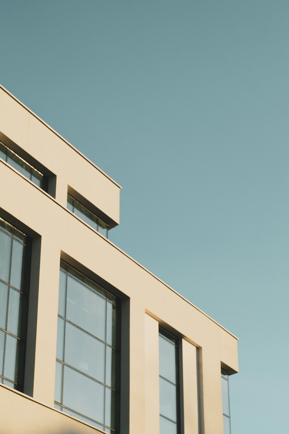 white concrete building under blue sky during daytime