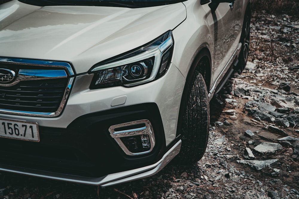 white bmw car on rocky ground