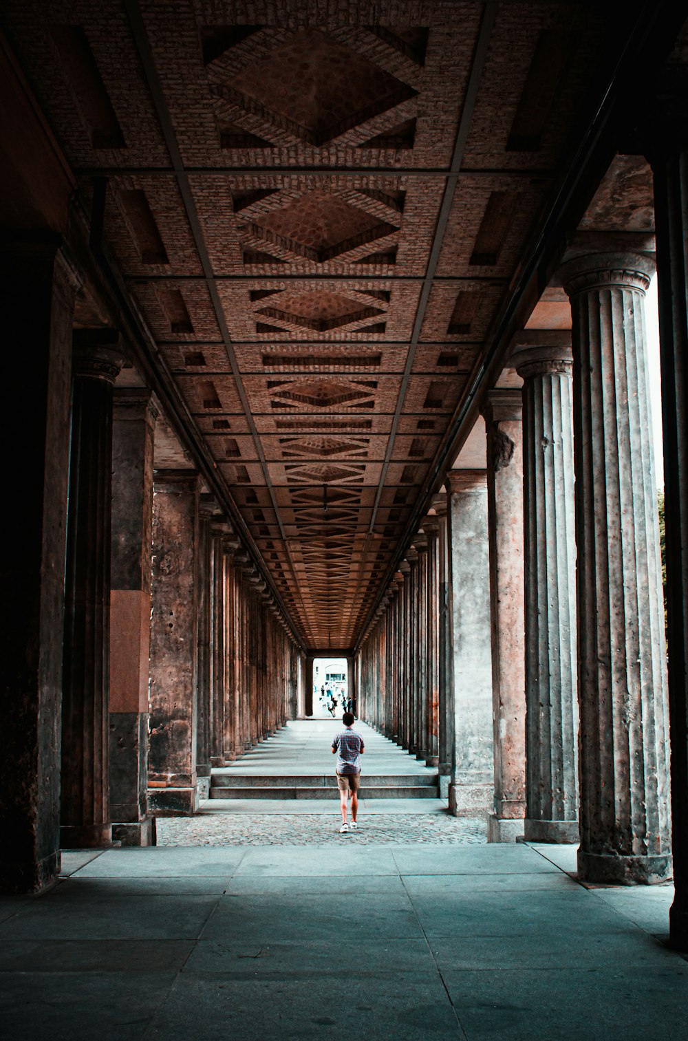 woman in white dress walking on hallway