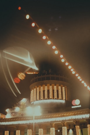 A commercial building decorated with dynamic multi-colored lights, featuring animated patterns synced perfectly to festive tunes.