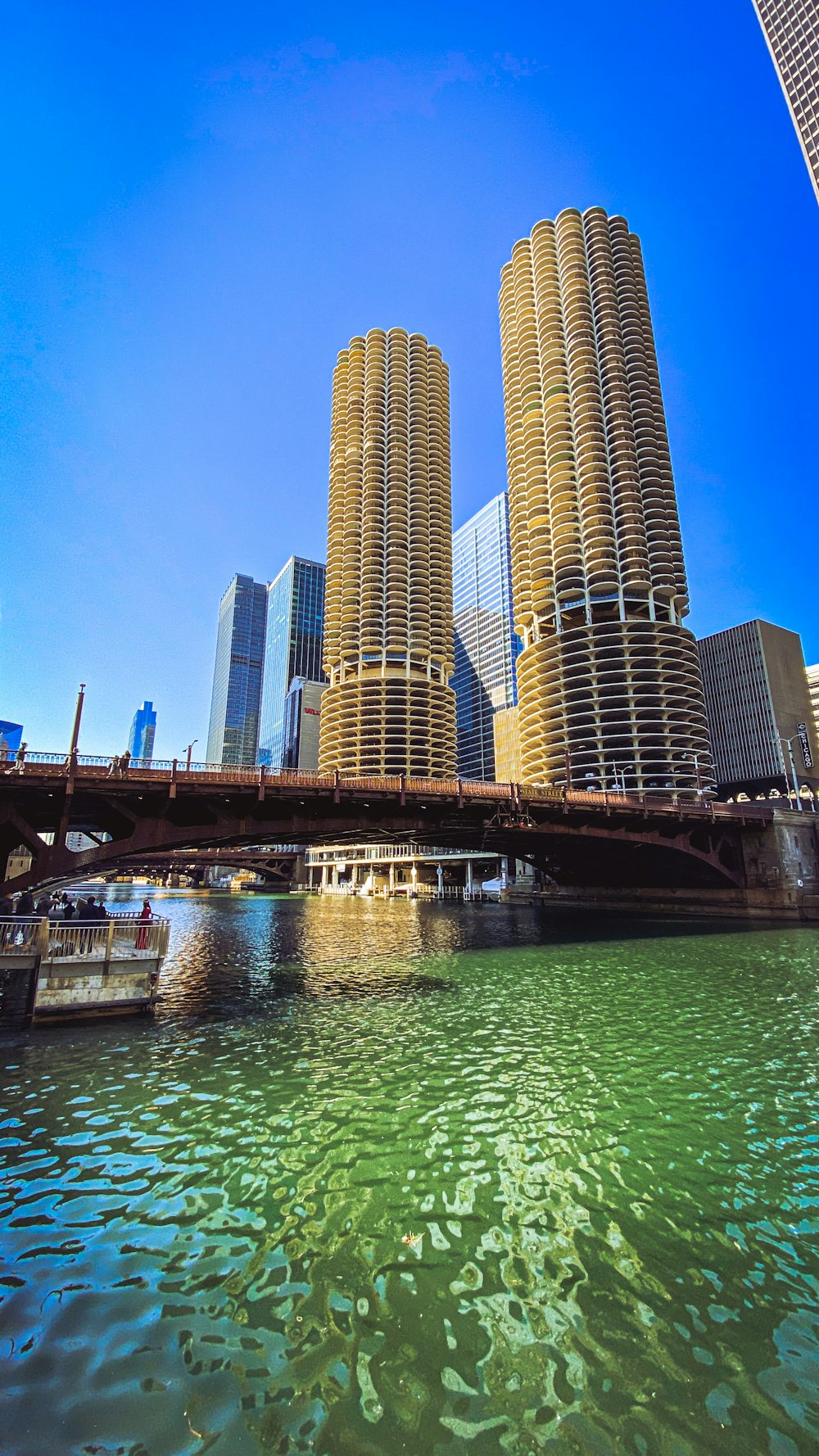 brown concrete building near body of water during daytime