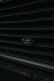 Close-up of a shiny Toyota Land Cruiser badge on a polished vehicle.