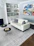 A beautifully designed abstract rug placed in a modern living room.