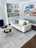 A beautifully designed abstract rug placed in a modern living room.