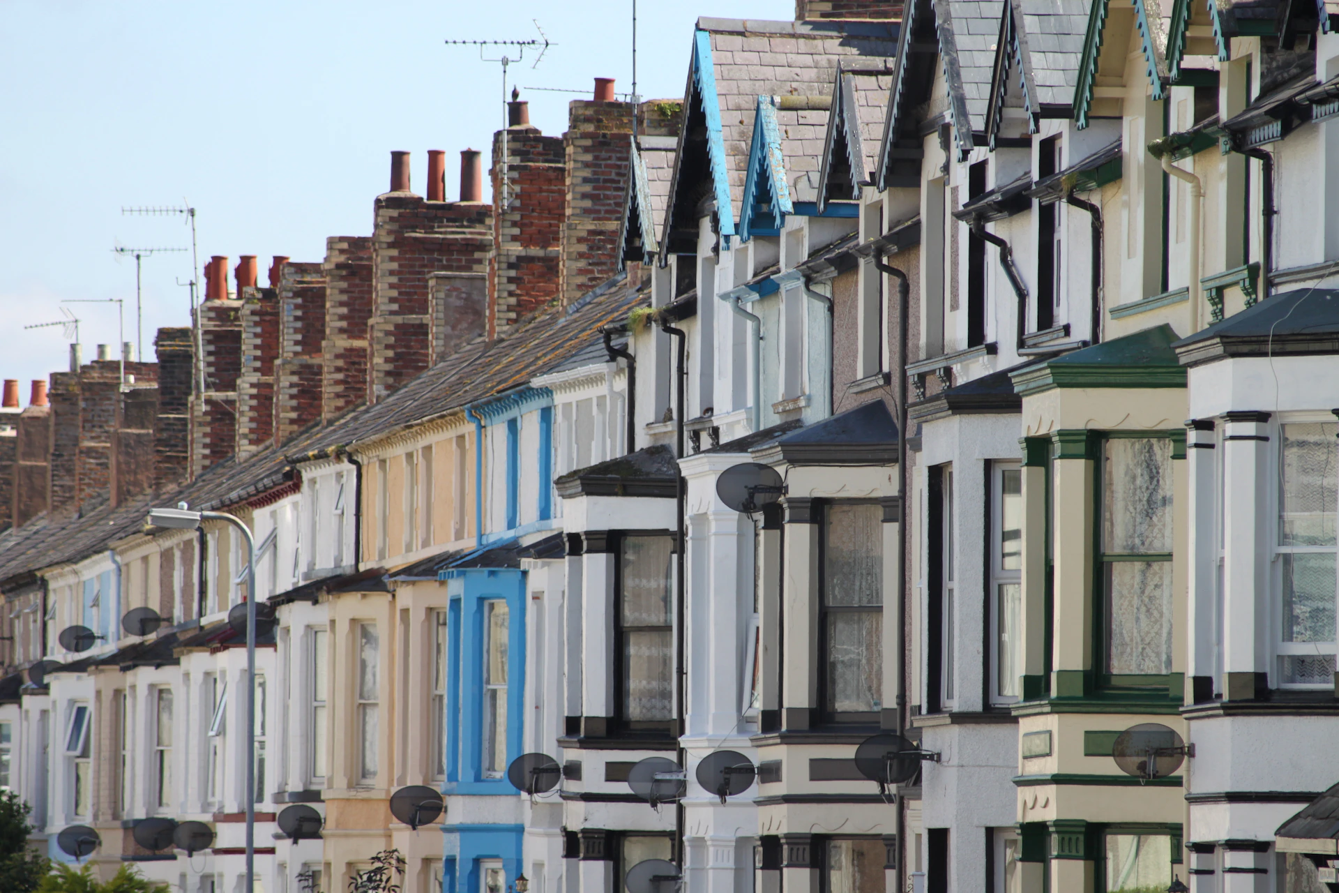 woman wearing yellow long-sleeved dress under white clouds and blue sky during daytime