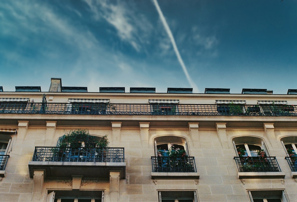 green and white concrete building under blue sky during daytime