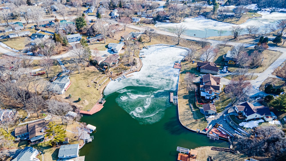 aerial view of city buildings near body of water during daytime