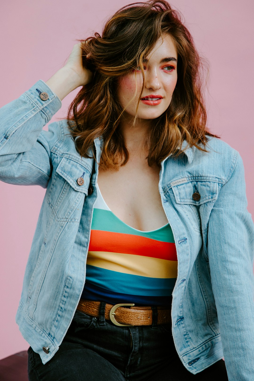 woman in blue denim jacket smiling