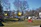 Before and after shots of a cluttered yard transformed by Junk Bros hauling service