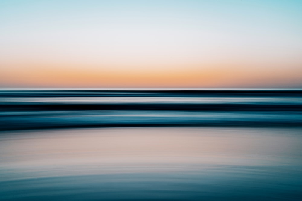 body of water during sunset