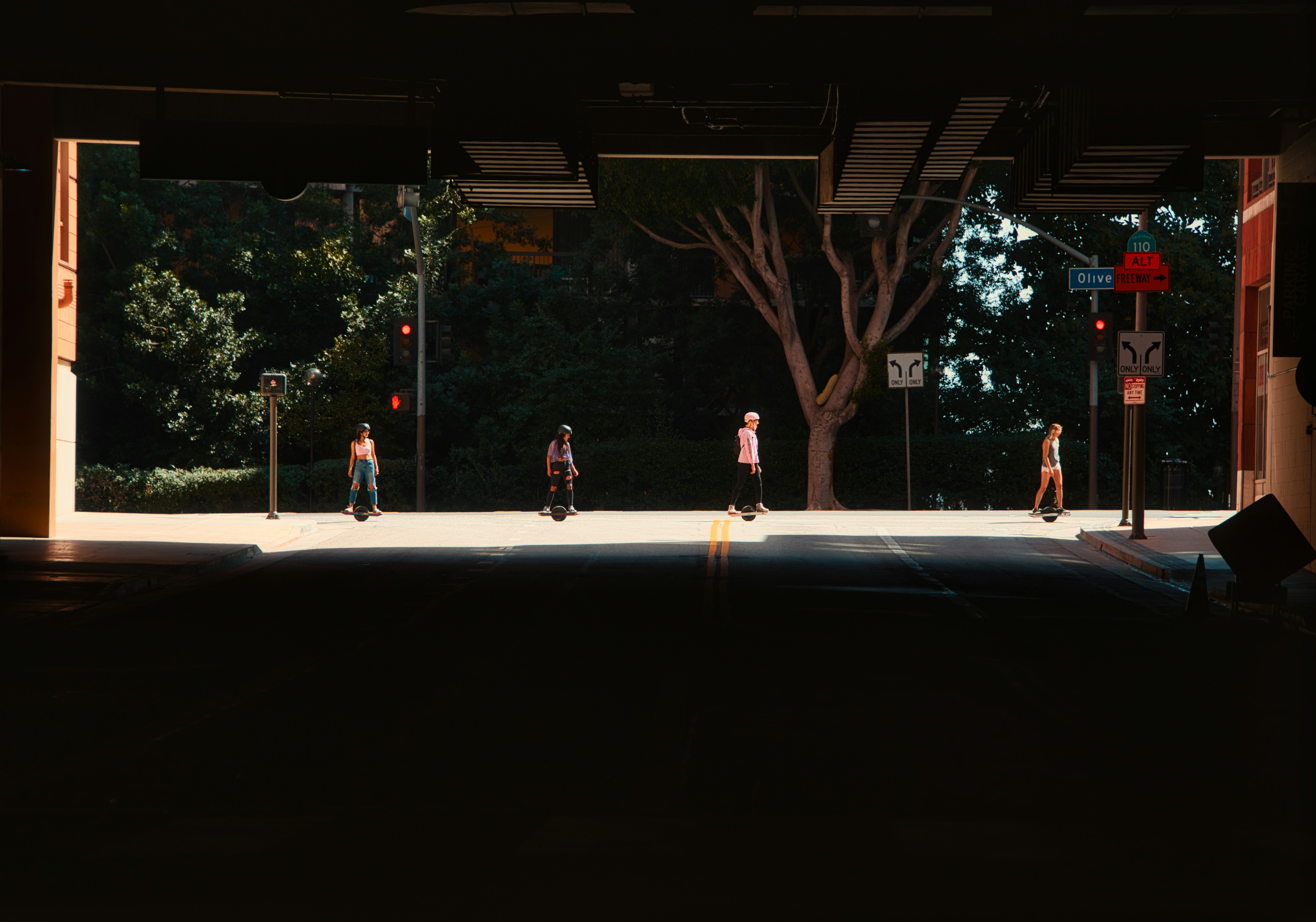 people walking on sidewalk during night time