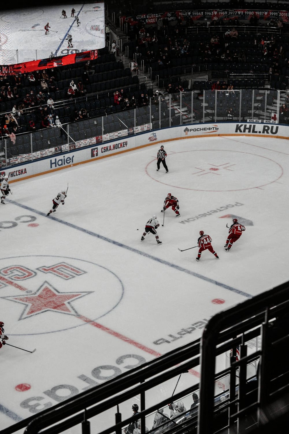 people playing ice hockey on ice stadium