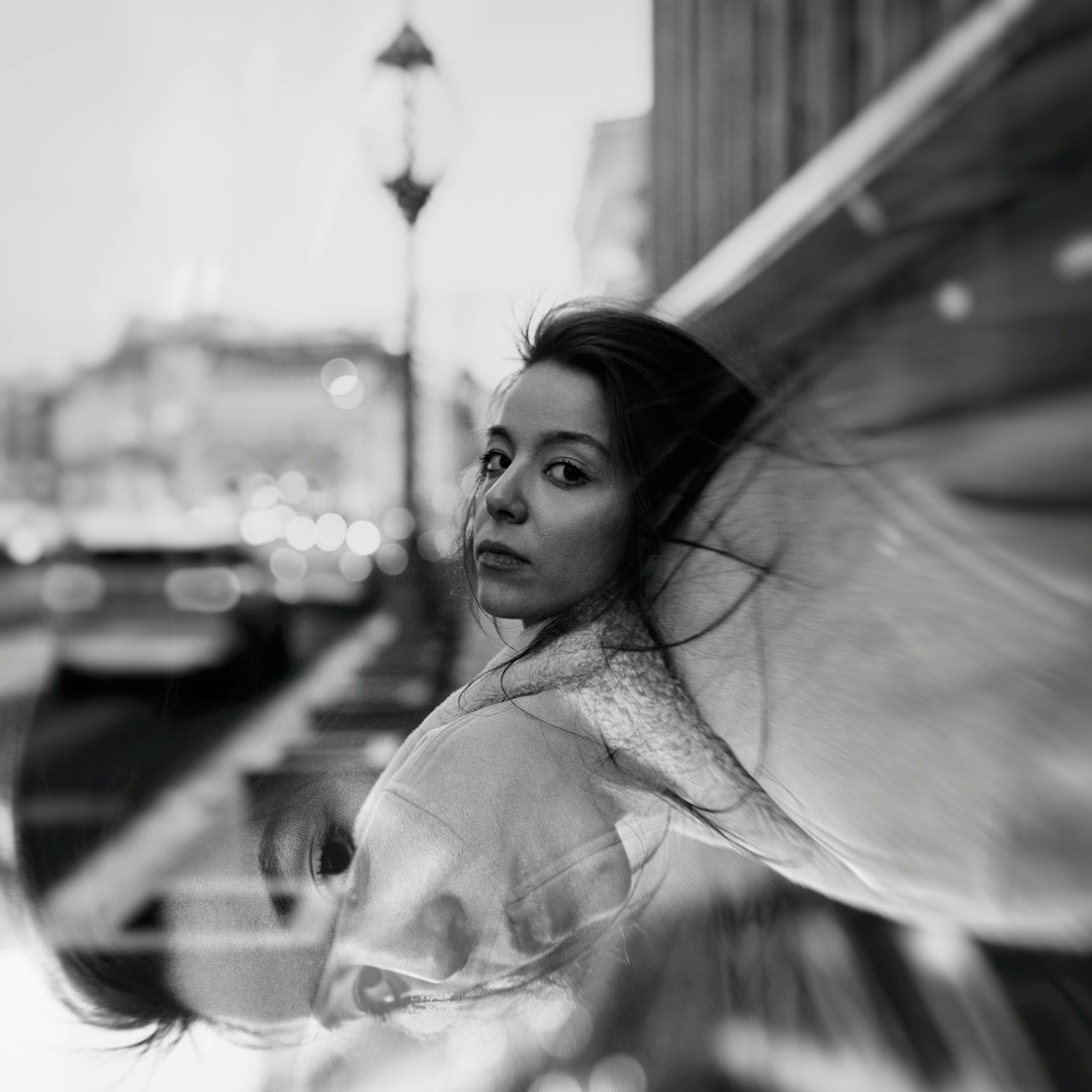 grayscale photo of woman in white lace floral dress