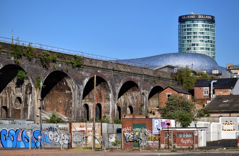 an old brick building with graffiti on it