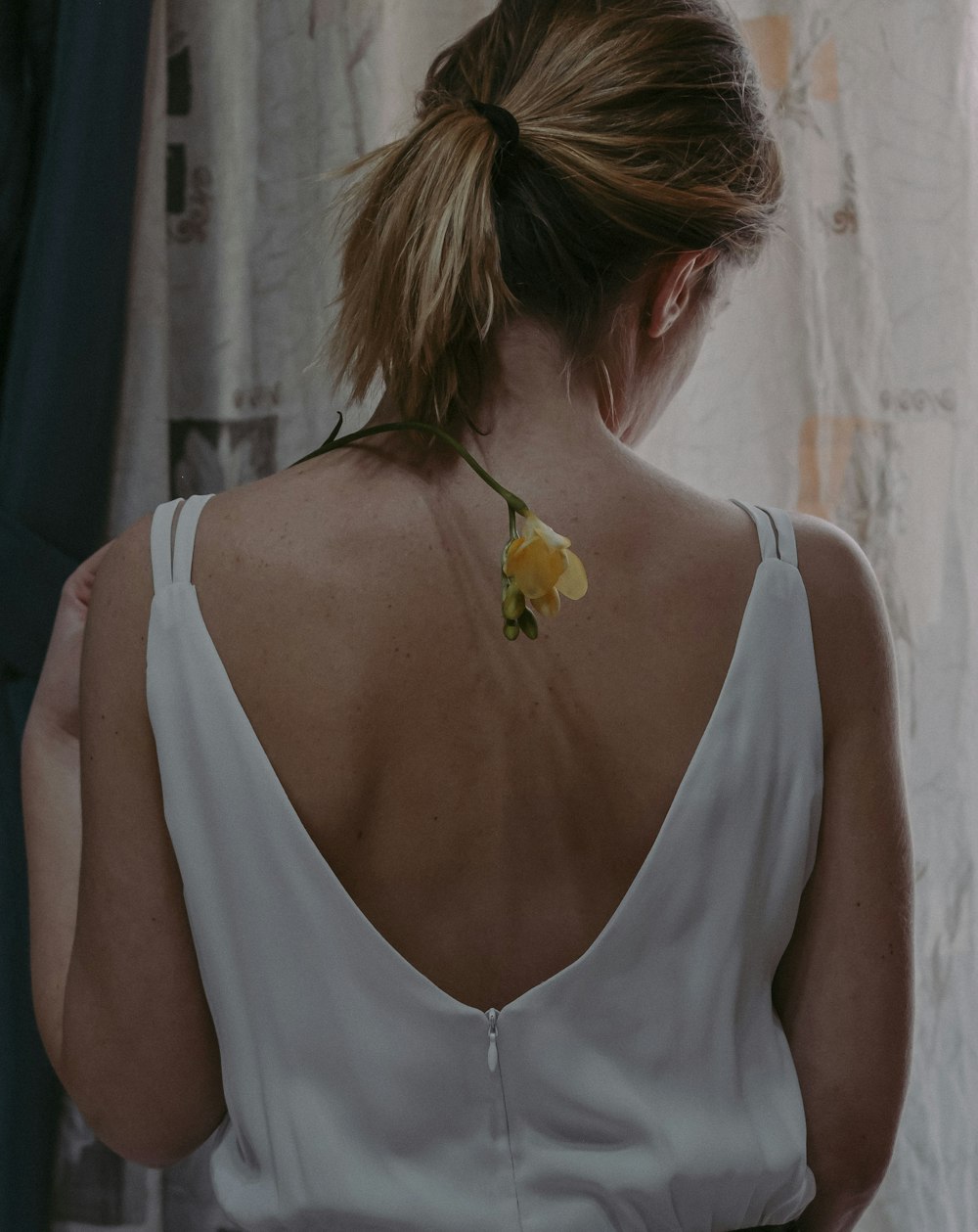 a woman with a flower in her hair